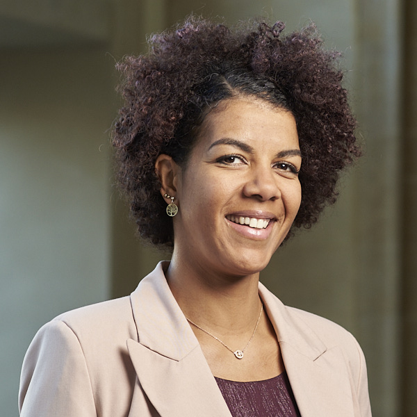 Klara Atere, a smiling woman in a pink blazer, OGMA HR